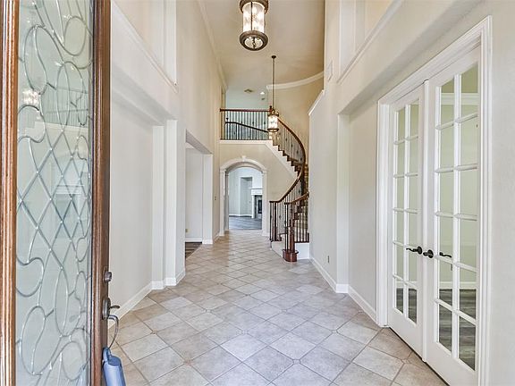 Beautiful Entrance and Stairway showing the beautiful tile and iron railings