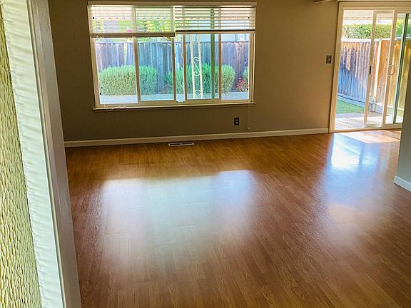Living room immediately to the left of front door.