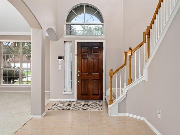 As you enter the front door, the formal living and dining is on the right, and staircase is to the left.
