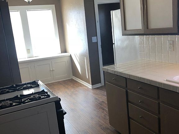 Kitchen has area for table with built in cabinets 