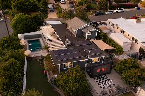 Spacious backyard packed with fun! Comfortable lounges, gather around the fire pit, cook on the pizza oven or BBQ, play the giant chess set, enjoy the playground, or watch movies on the large projector screen. Endless ways to play and unwind.