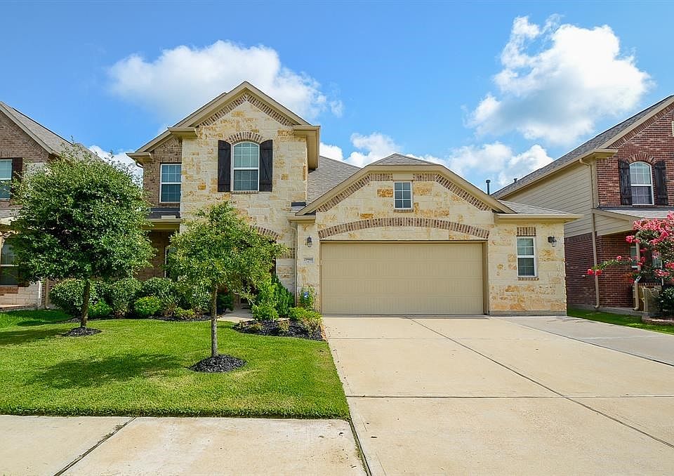 Welcome home to 29980 Cloud Brook! This immaculate home is ready for its new owners! It has an upgraded stone elevation with a 2 plus car garage, perfect for storage!