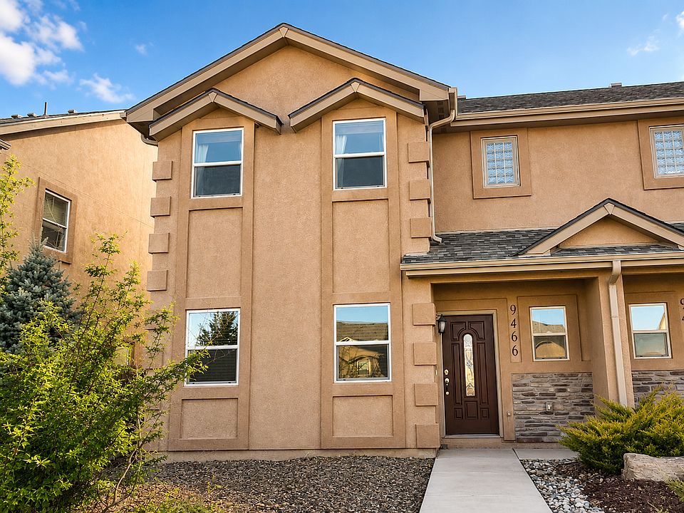 Your front door _ stone accents, covered entry, and plenty of Colorado sunshine