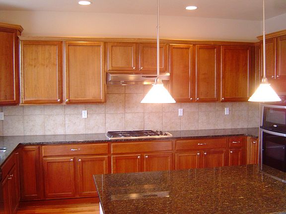 Spacious Kitchen with Cherry Cabinets