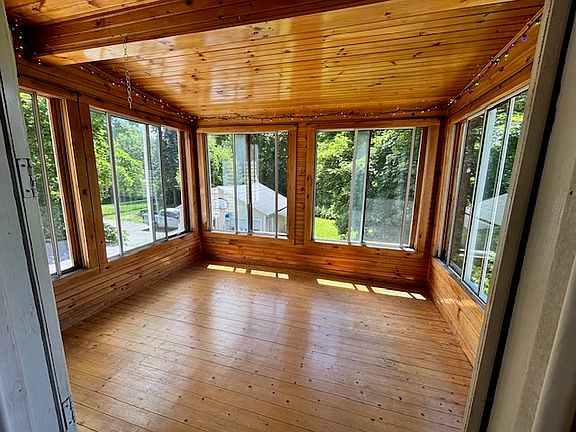 Delightful porch viewed from kitchen. Back view of yard. Note: back yard is for first floor tenants.