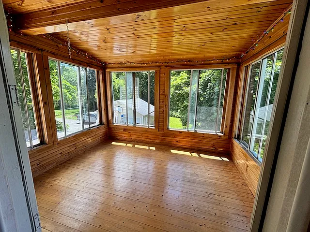 Delightful porch viewed from kitchen. Back view of yard. Note: back yard is for first floor tenants.