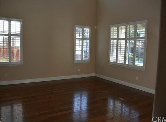 Formal Living room with large window with view to front of home and porch area.