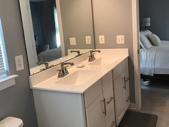 Master bathroom with walk-in shower and walk-in closet