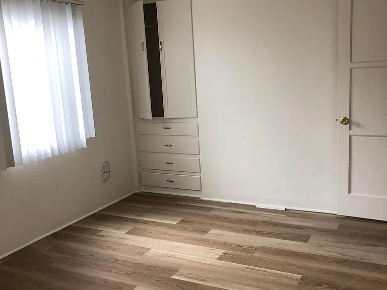 Bedroom with built in drawers and storage
