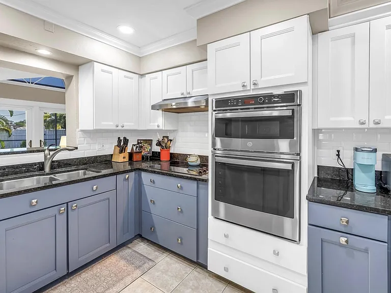 Updated kitchen with ample cabinet storage, double wall ovens, and generous counter space for daily cooking and prep.