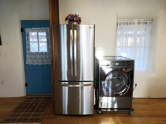 Stainless Steel Refrigerator and ventless washer/dryer in one.