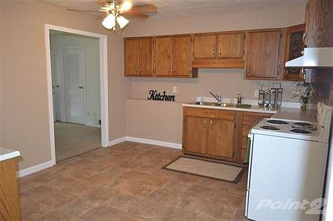 Kitchen with new flooring & cupboards.
