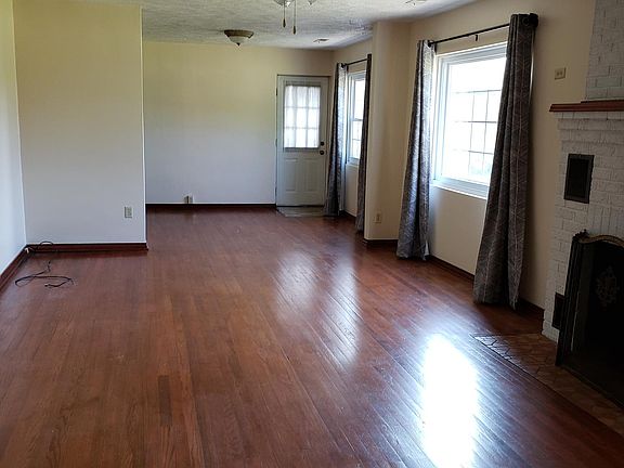 Living room and dining room featuring all hardwood floors