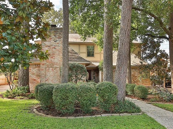 Home with great curb appeal on large wooded lot.