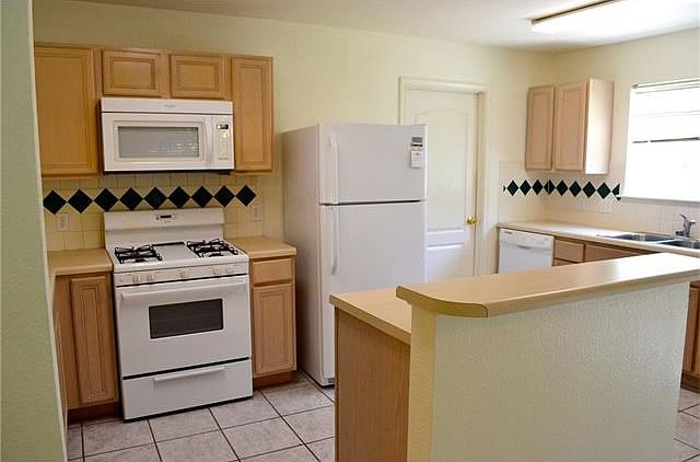 Gas stove top, large pantry, center island and large window