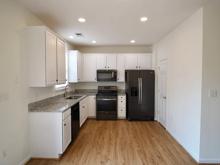 Gourmet kitchen with granite countertops and stainless steel appliances
