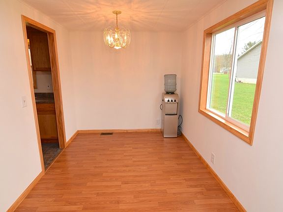 Dining room off the kitchen with a new large window.