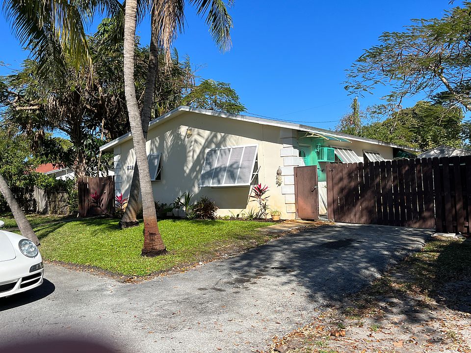 Front of the property with circular driveway.