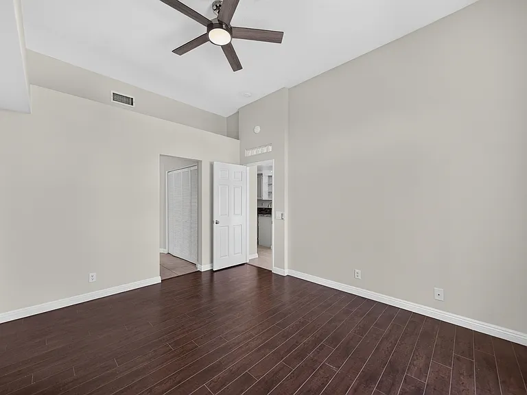 PRIMARY BED HAS NEW CEILING FAN AND ENGENIERED WOOD FLOORING