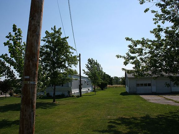 side view, telephone pole about property line on side