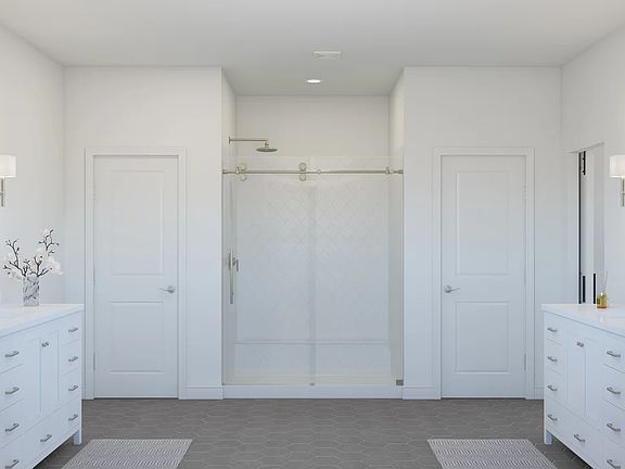 Primary bath with glass shower enclosure