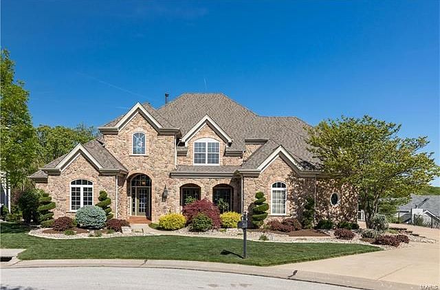 Exquisite Miceli built home featuring Stone & brick front.