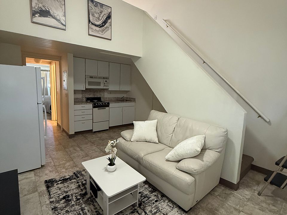 Living Room View w/stair way/kitchen and entrance to bedroom