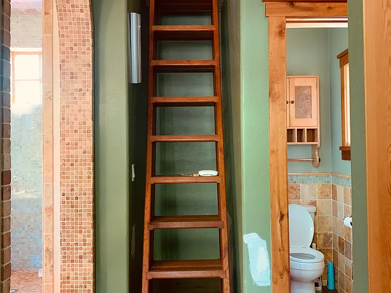 Ladder to loft above main floor primary bedroom