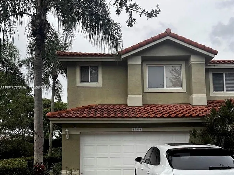 12591 NW 57th Pl #TOWNHOUSE — Photo 1