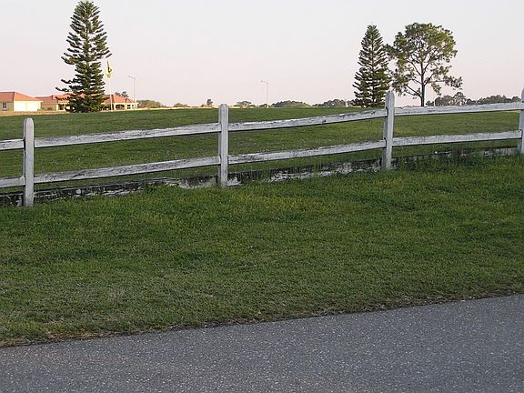 JUST ACROSS CANAL IS A ROAD AND GOLF COURSE