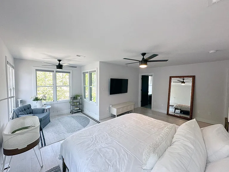 Master bedroom with TV mount, walk in closet and master bathroom.