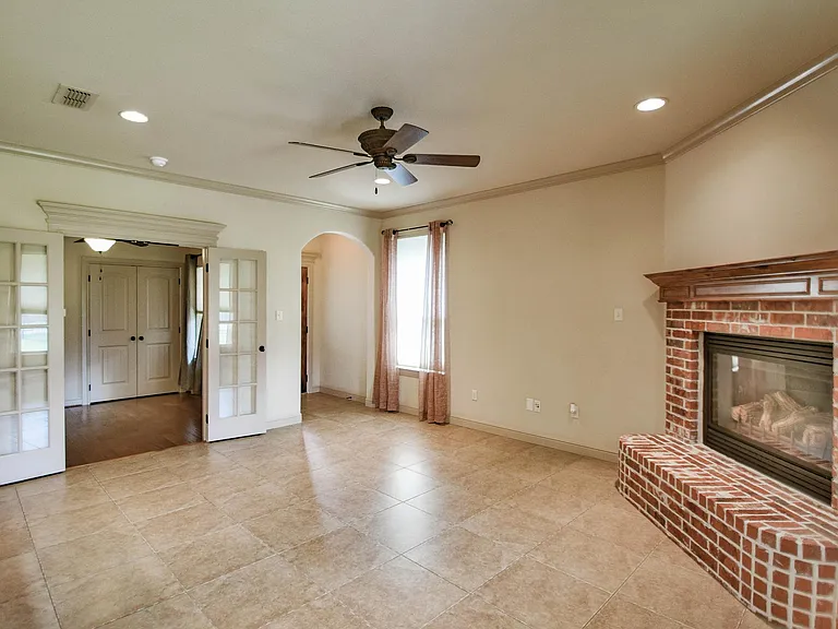 Another angle of the living area looking toward entry and 3rd bdrm or study