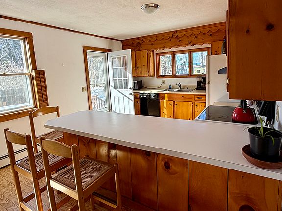 spacious kitchen with door out to deck