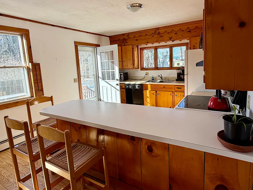 spacious kitchen with door out to deck
