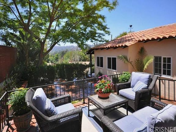 Private front courtyard with hillside views.