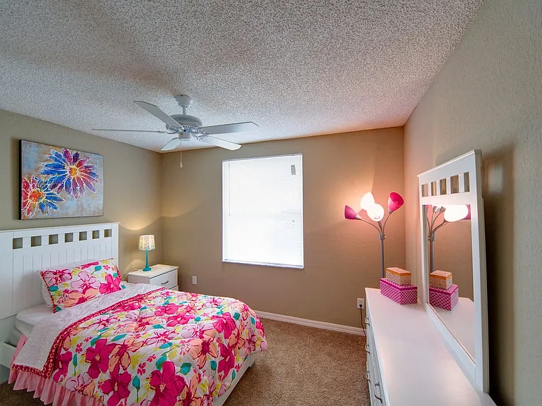 Bedroom with plush carpeting and a ceiling fan at Gregory Cove in Jacksonville, FL