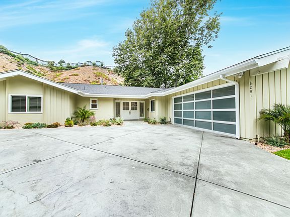 View of house, parking and garage