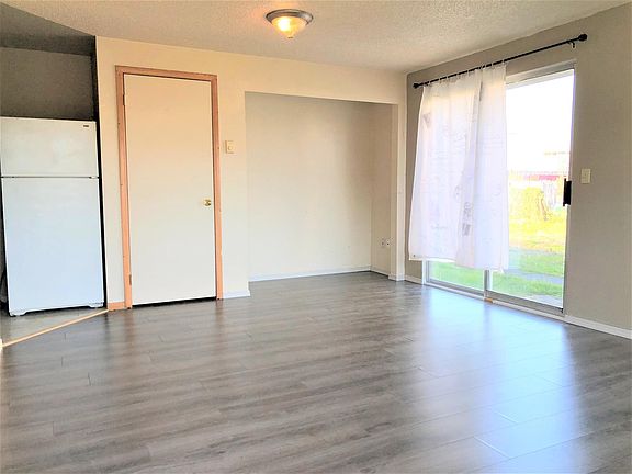 Spacious living room with sliding door, full of natural lights
