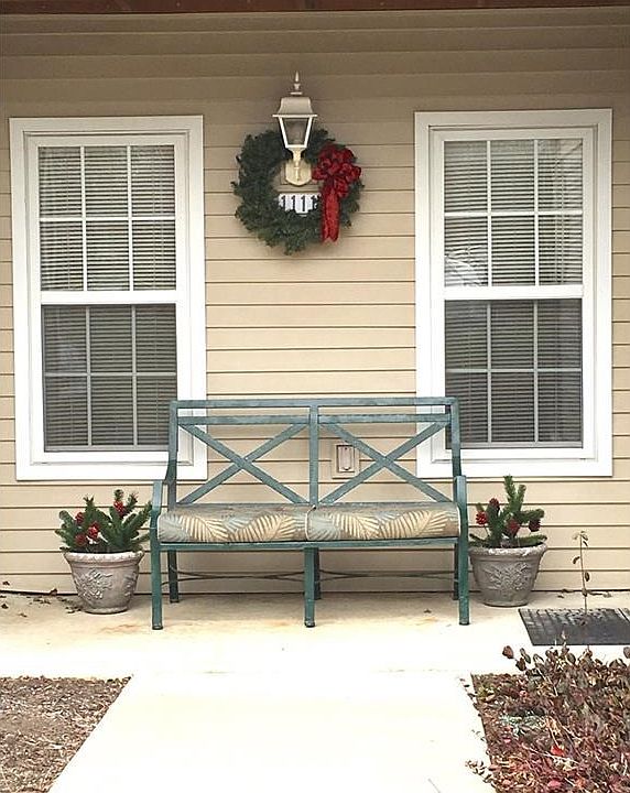 Welcome to Lenox Ridge Unit 1111.  This first story end unit features three bedrooms and two full bathrooms, a detached one car garage, and loads of storage.