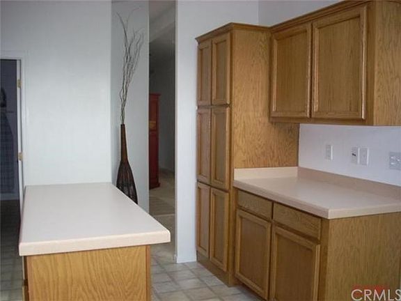 Another view of kitchen storage and counters