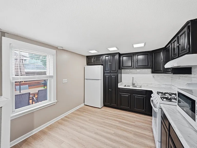 Kitchen with Natural Gas Range and Expansive Cabinetry