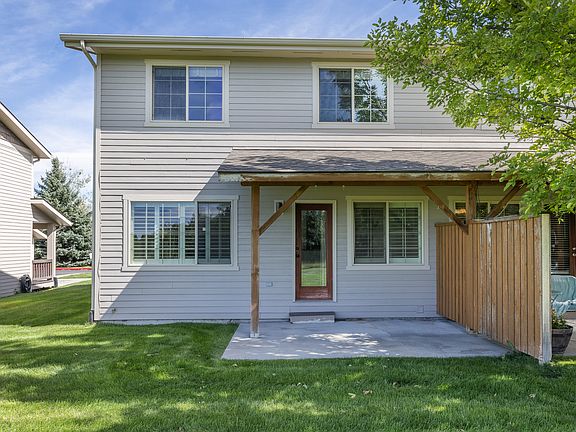 West facing back covered patio, opens to park space and trails