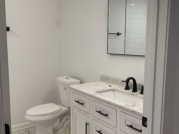 Upstairs Shared Bathroom with shower and bathtub.