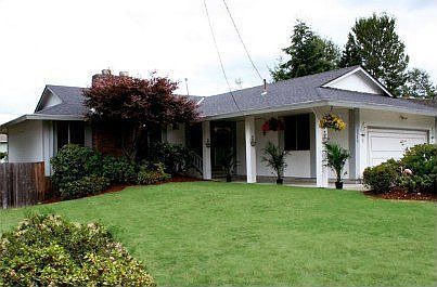 Huge outside entry with double doors greets you when you enter this home.