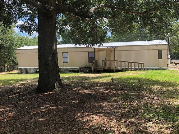 Back View with covered porch & handicapped ramp