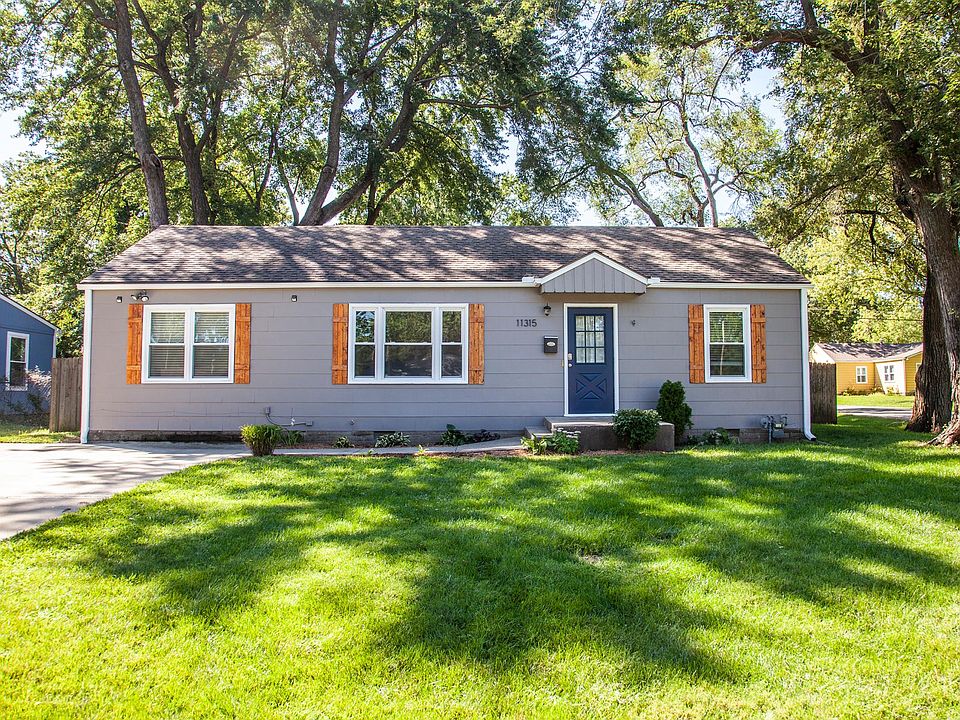 Fresh exterior paint, new shutters and well-kept flowerbeds