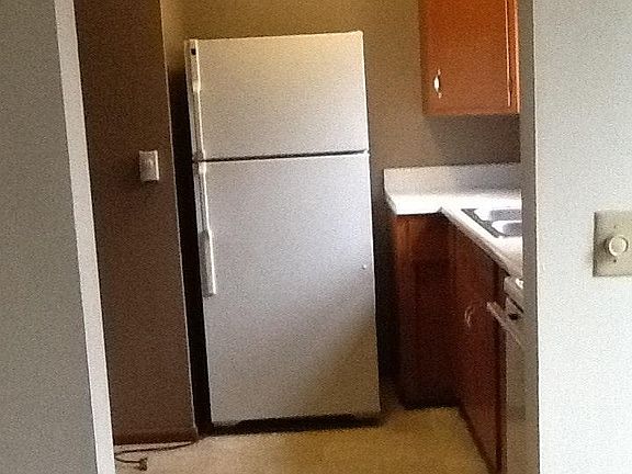 Kitchen has stove & refrigerator, 1/2 bath off kitchen