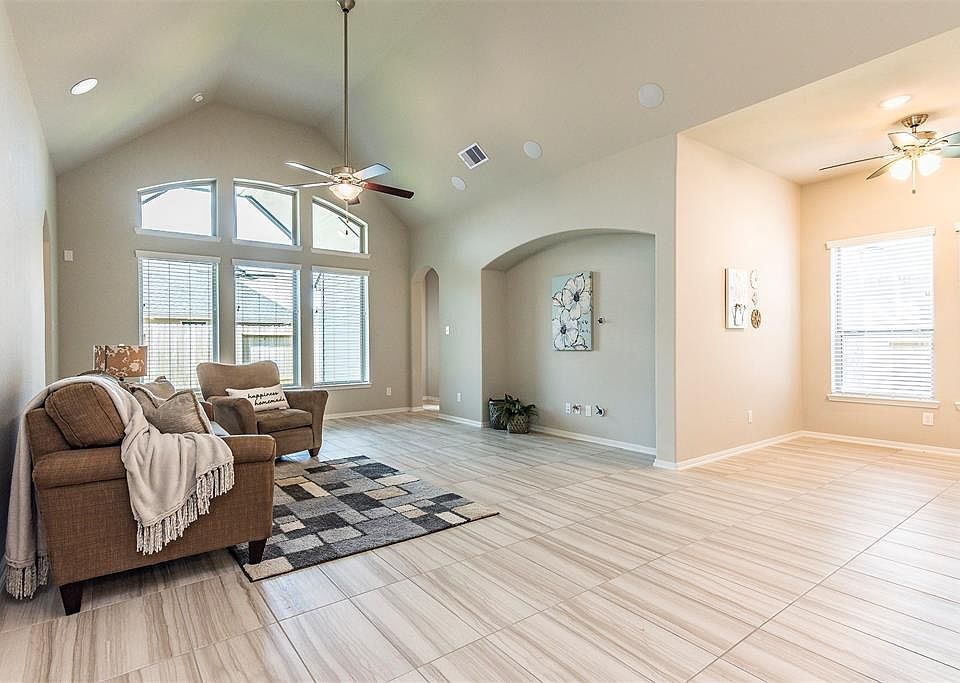 Beautiful family room has a vaulted ceiling, bright window and very large media nook, wired for sound!