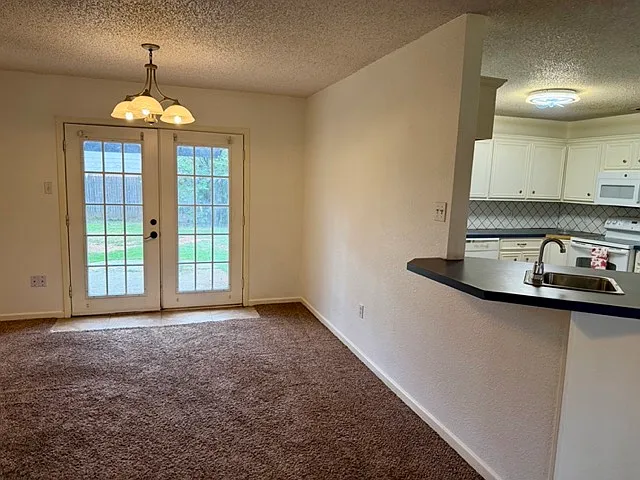 Dining room and kitchen.