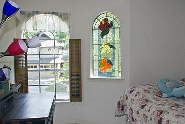 The two upstairs bedrooms are welcoming places of light and beauty.